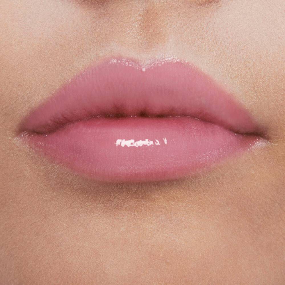 Close-up of soft, glossy pink lips.
