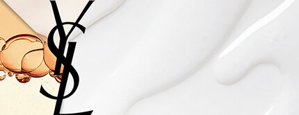 A split image featuring the logo of Yves Saint Laurent on the left, with a background of liquid bubbles in a warm amber tone, and on the right, a smooth, white cream texture.