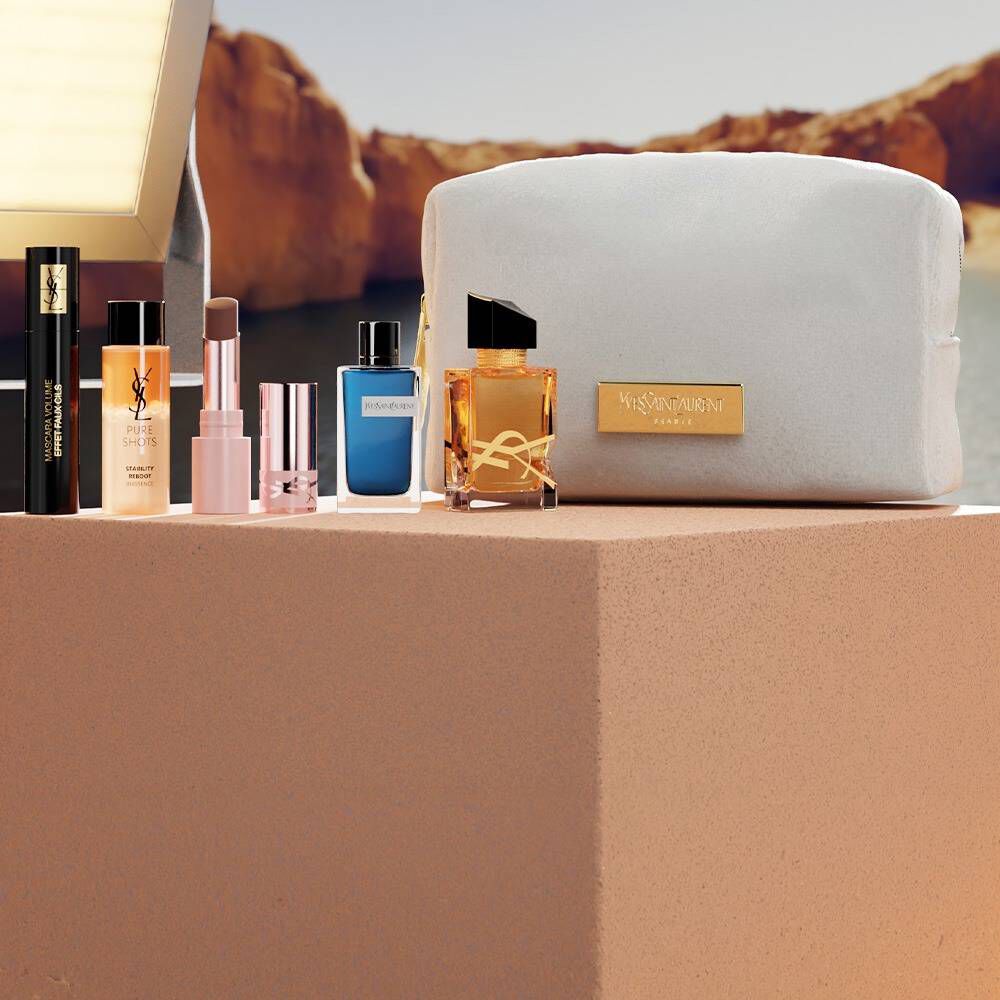 Set de belleza YSL con miniproductos y neceser blanco.