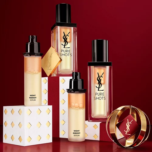 Frascos del serum YSL Pure Shots Night Reboot y embalajes festivos.