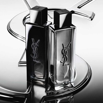 Dos frascos de perfume YSL en negro y plateado