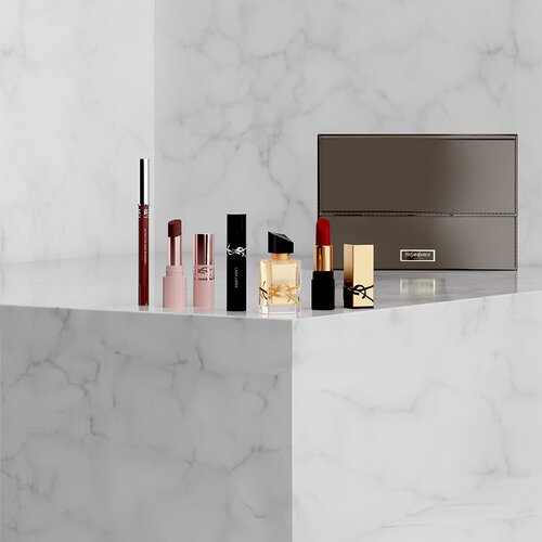 Set de belleza YSL con miniproductos y neceser.
