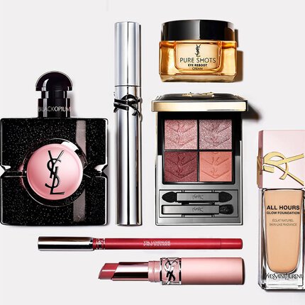 Disposicion de productos de belleza YSL que incluye perfume, tratamiento y maquillaje.