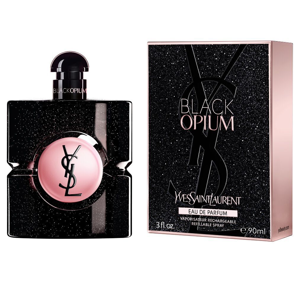 Frasco de Black Opium Eau de Parfum junto a su caja negra con purpurina a juego, adornada con la Cassandre de YSL.